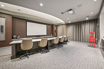 A conference room with a long table and chairs at Everra Midtown Park Apartments, Texas